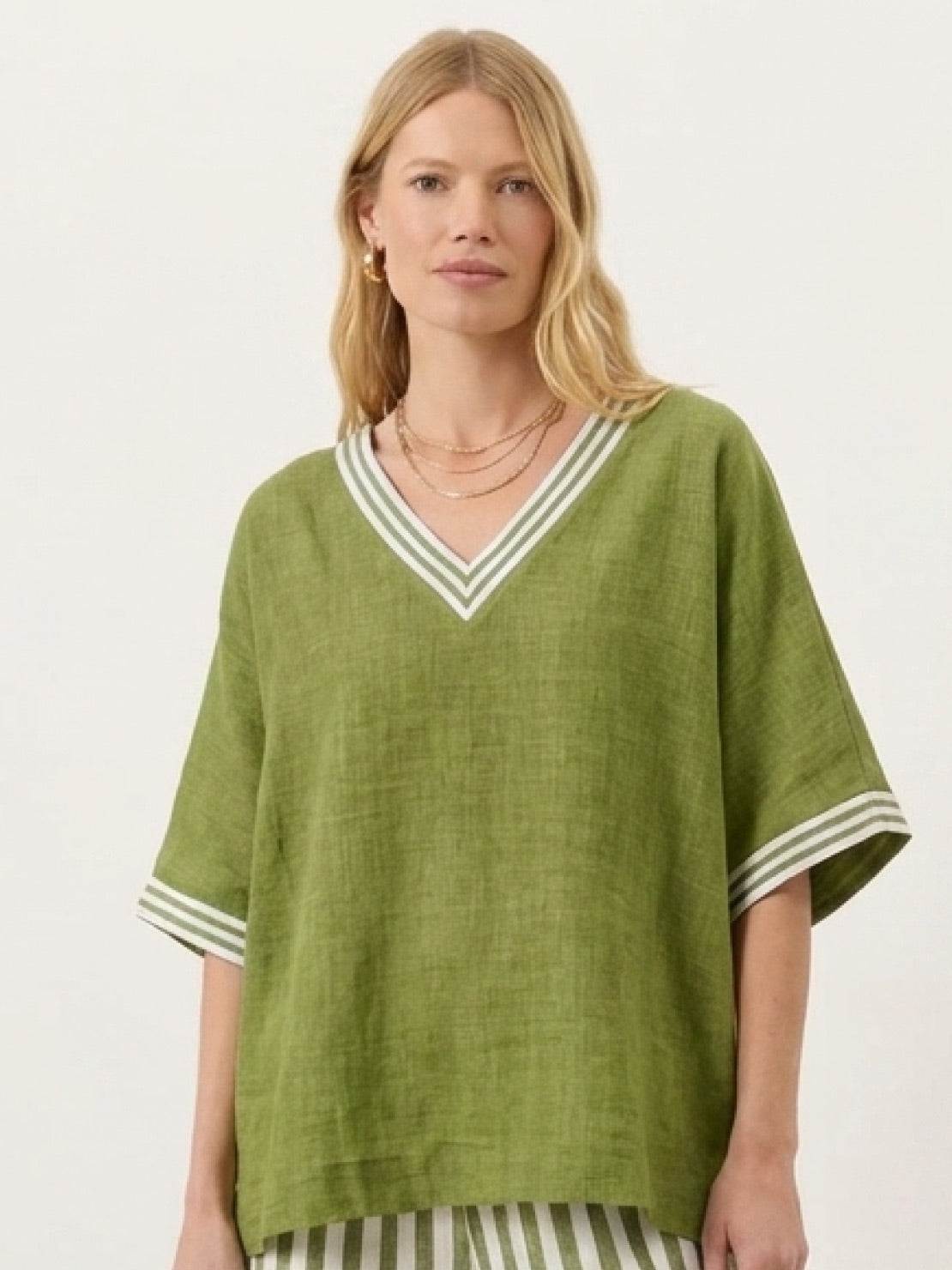Woman wearing striped wide-leg co-ord set with oversized top and palazzo pants
