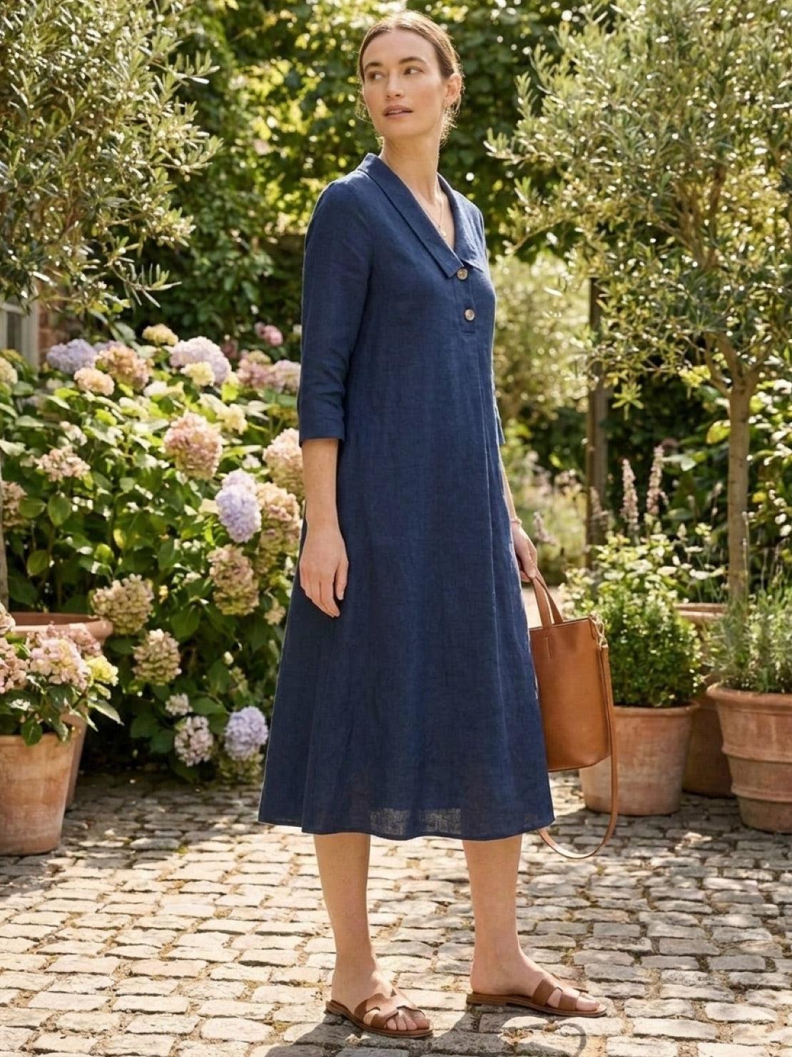 Navy linen-look midi dress with relaxed A-line fit, 3/4 sleeves, button detail, and side pockets