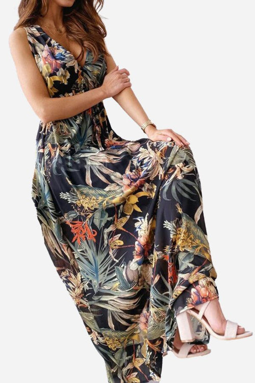 Woman wearing a casual sleeveless dress with colorful floral print and v-neck design