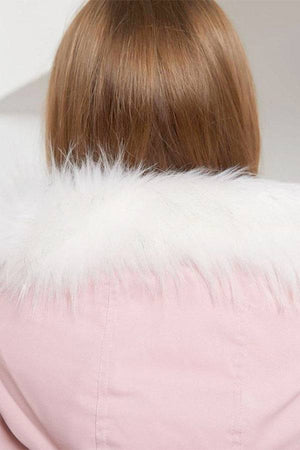 Back view of pink thick long-sleeve zipper overcoat with white fur collar on woman