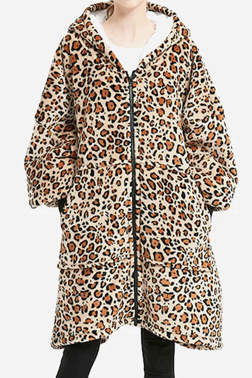Oversized ultra soft hooded blanket with leopard print, front zipper, large pockets, and cozy flannel sherpa material.