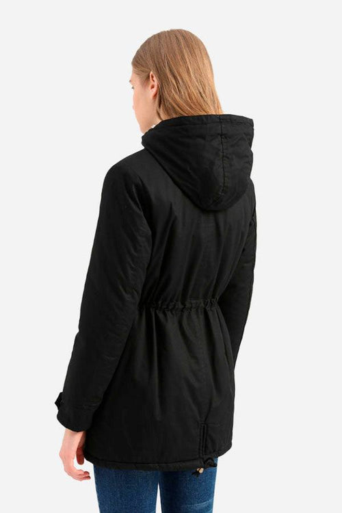 Woman wearing black extra comfortable cotton parka coat with hood, back view