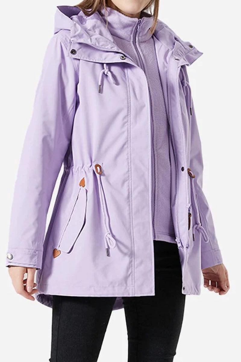 Woman wearing a lavender Versatile Chic Two-Piece Windbreaker Set with adjustable hood and slim-fit design