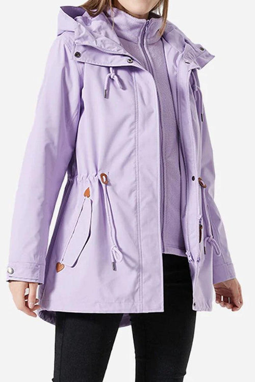 Woman wearing a lavender Versatile Chic Two-Piece Windbreaker Set with adjustable hood and slim-fit design