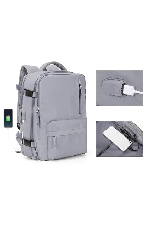 Chic Wanderlust Waterproof Backpack in grey with USB charging port and multiple compartments, durable and ergonomic design for travel and urban use.