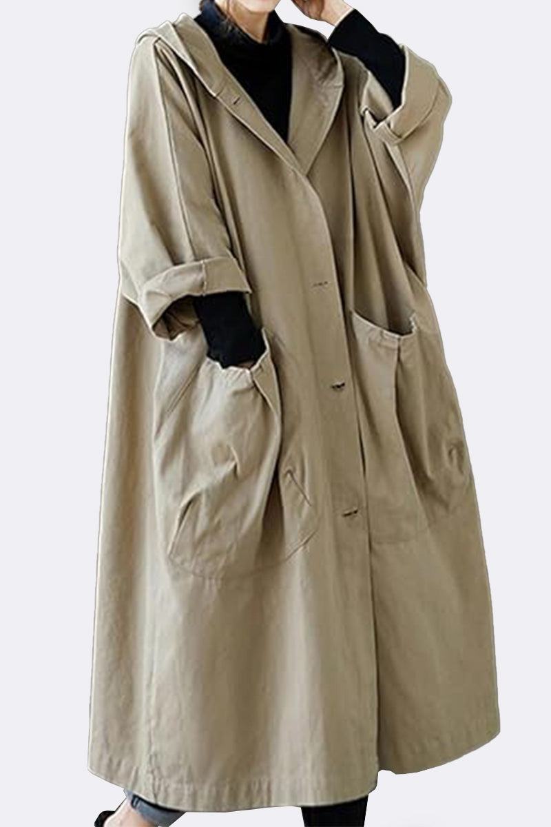Oversized beige water resistant windbreaker jacket with pockets and hood for layering