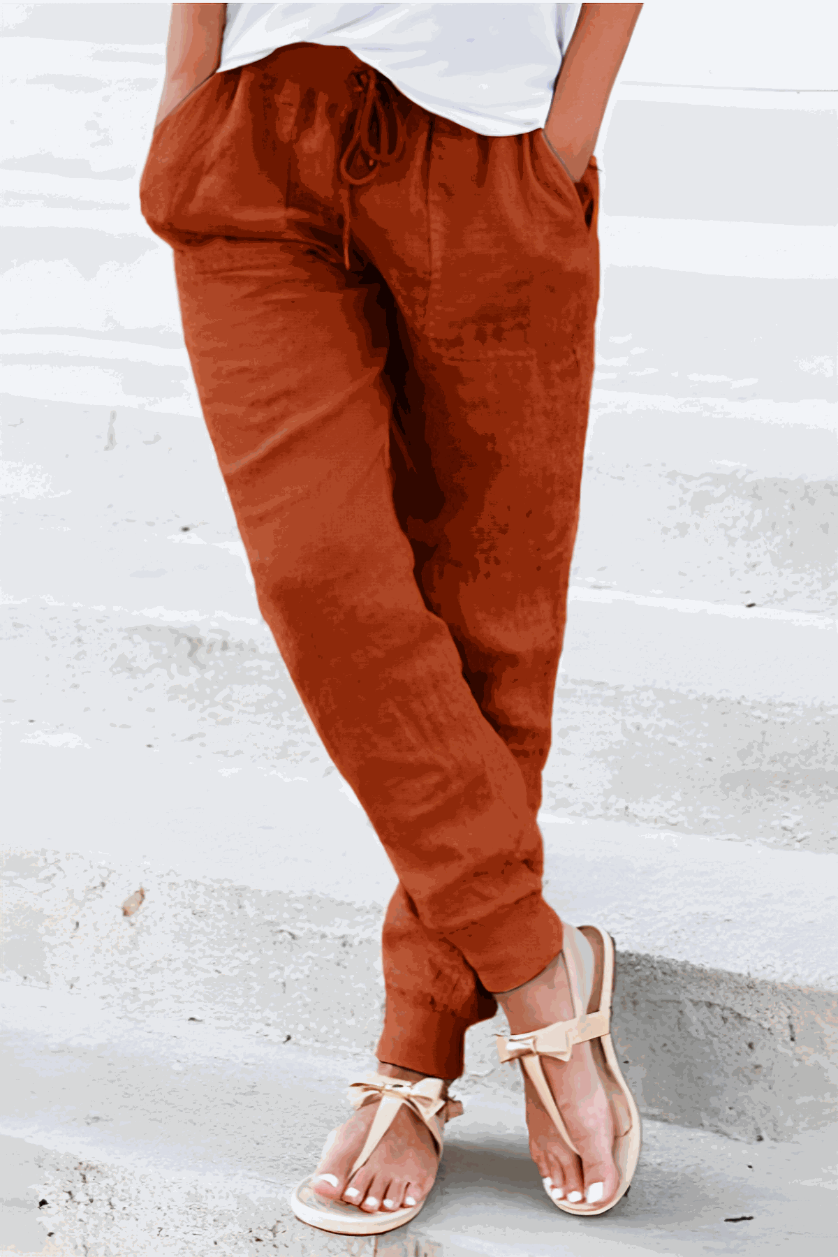 Women's relaxed chic elastic ankles pants in rust color, casual comfortable fit with drawstring waist and elastic cuffs.