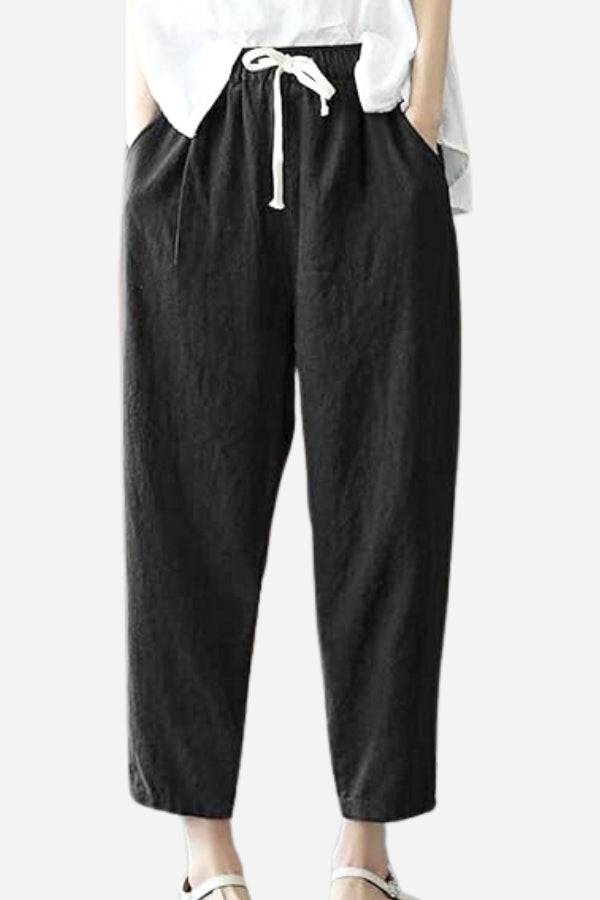Black relaxed fit straight pants with drawstring waist and side pockets for casual comfort