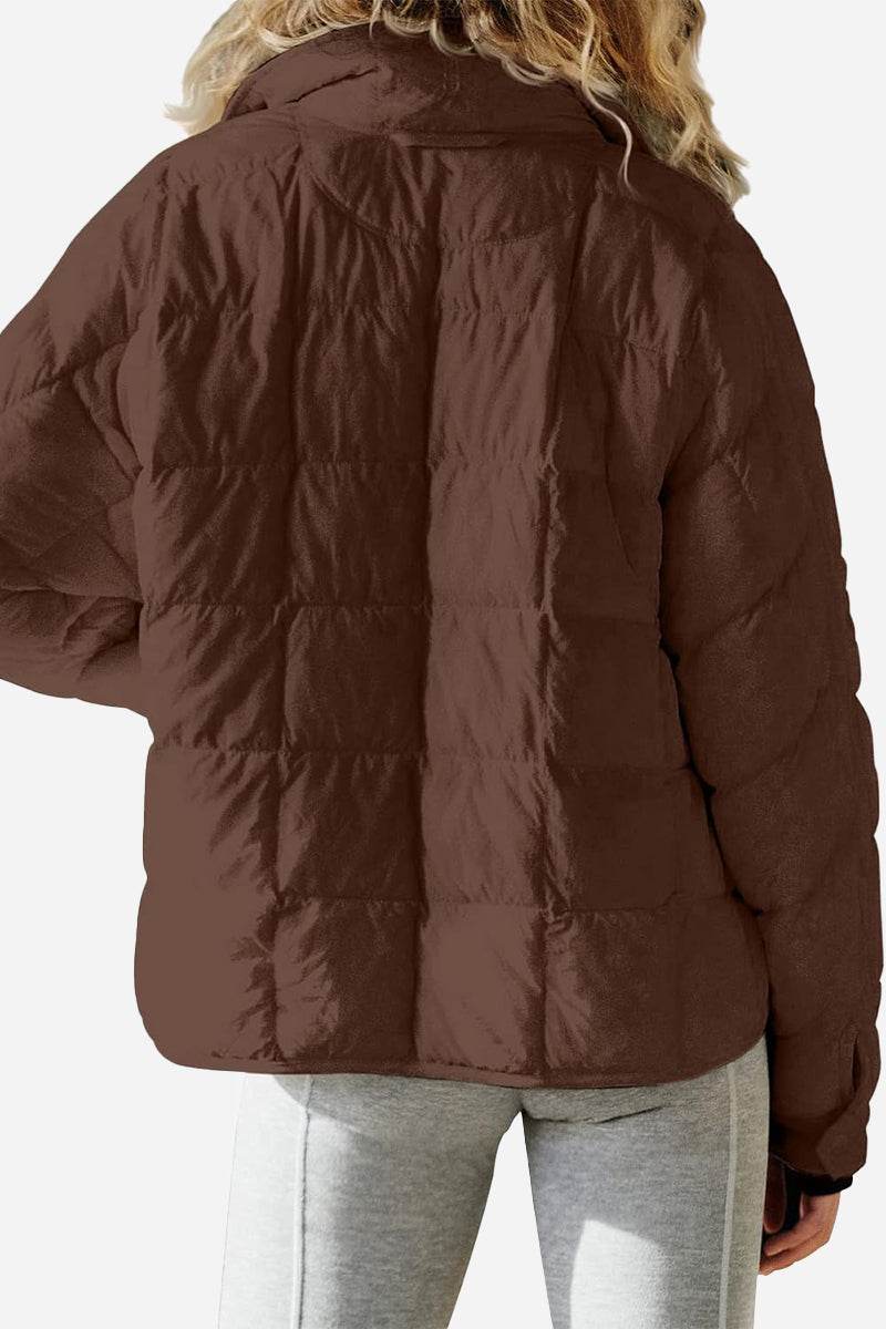 back view of lightweight puffer travel jacket in brown on model