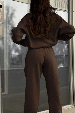 Woman wearing brown cotton-blended two-piece tracksuit standing outdoors