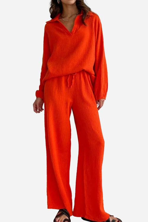 Women's bright orange cotton collared two-piece set with bishop sleeves and drawstring waist pants