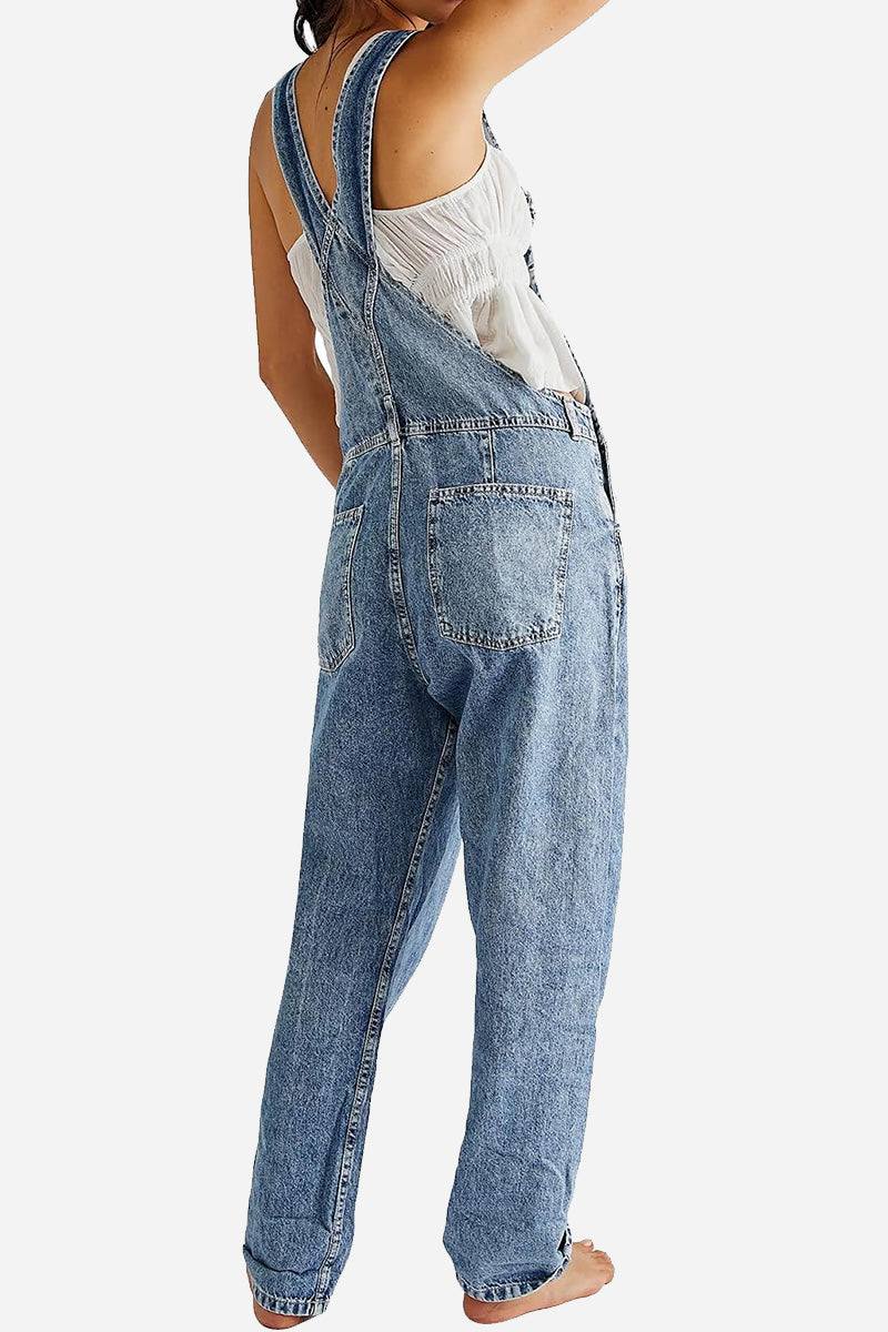 Woman wearing denim-look tapered-leg adjustable bib overalls in a casual pose