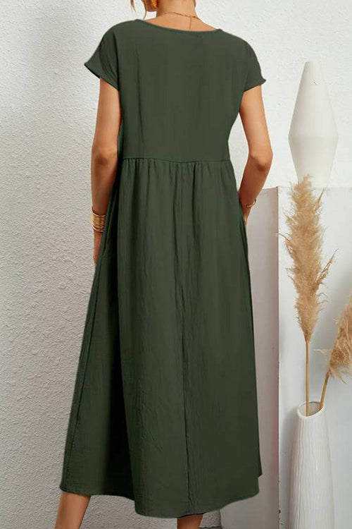 back view of capped-sleeve voluminous pleated midi dress in olive green