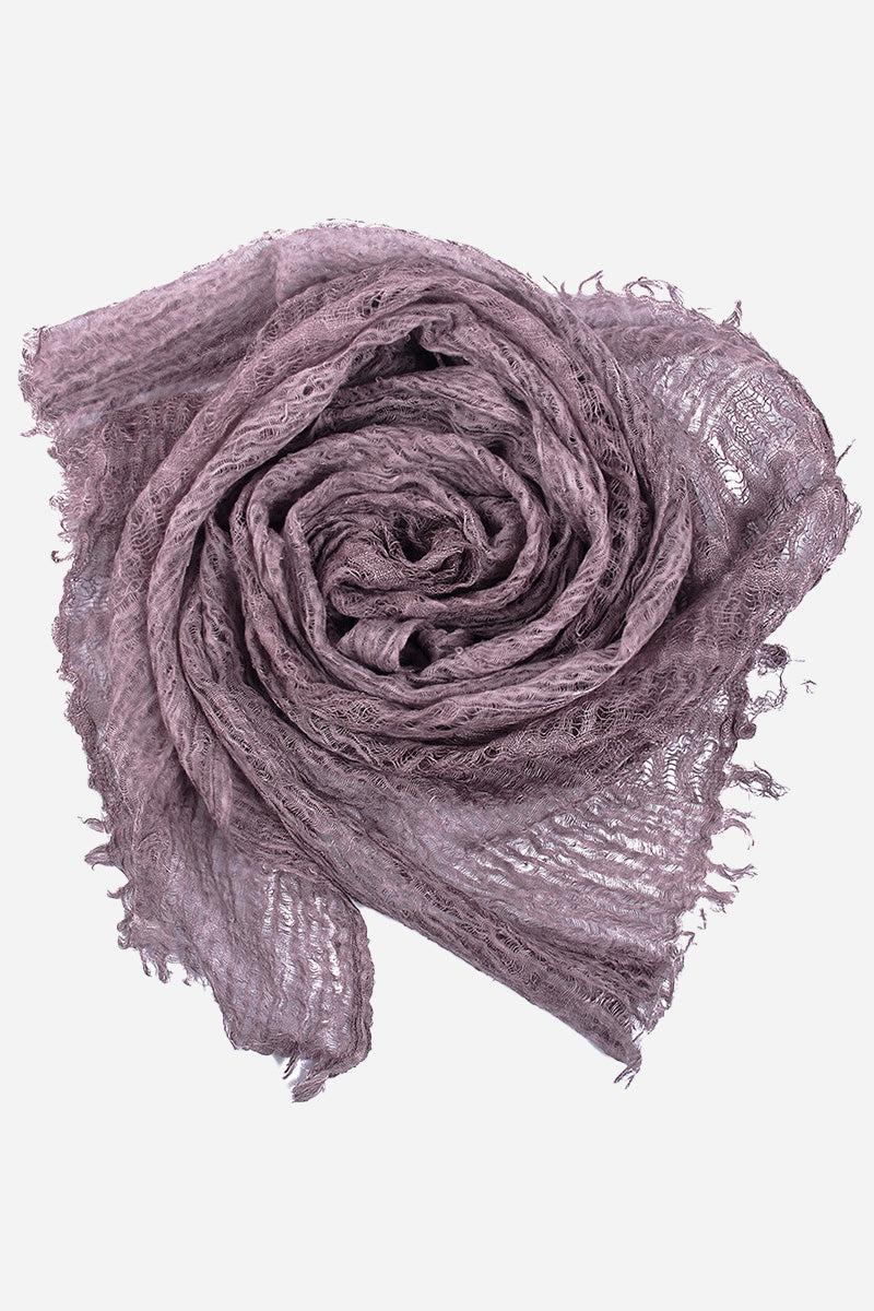 Rolled lightweight linen scarf with frayed edges in soft mauve color