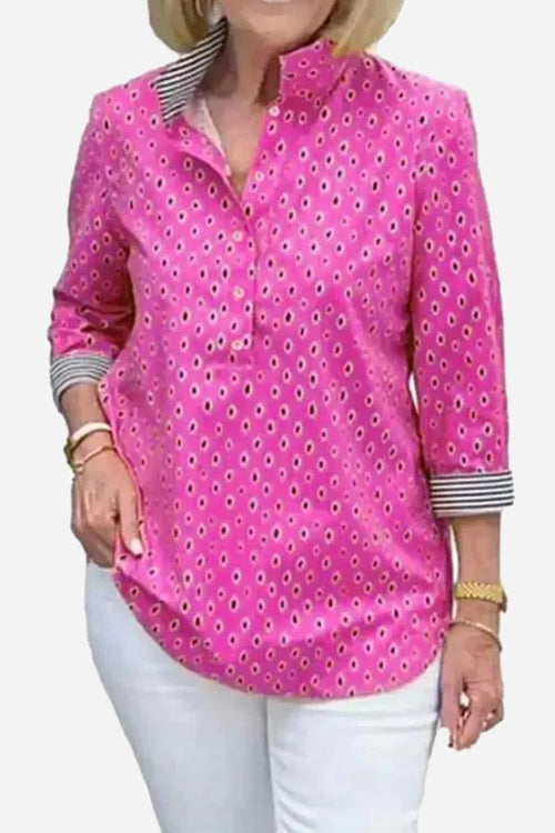 Boho chic resort blouse pink with polka dots and striped cuffs worn with white pants