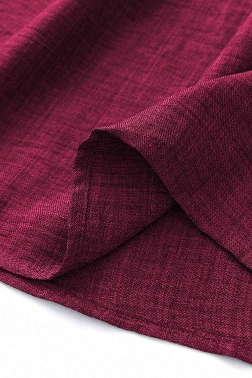 Close-up of lightweight burgundy fabric for high waist wide leg pants showing texture and softness