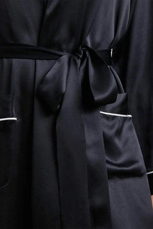 Close-up of black Mulberry Silk Nightgown with sash belt and pockets detailing