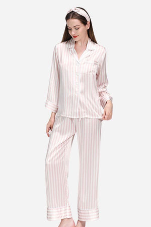 Woman wearing 100% mulberry silk striped long sleeve pajama set with matching pants and headband