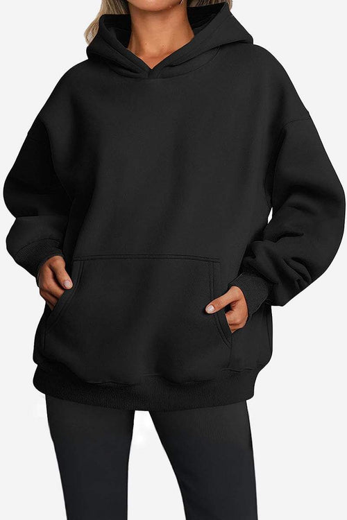 Black oversized fleece-lined hoodie with front pocket and relaxed fit for cozy warmth
