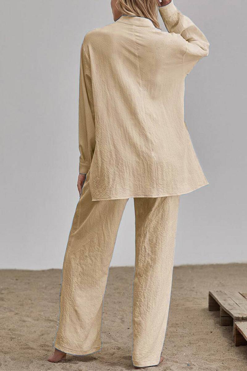 Back view of beige linen blend two-piece set with loose fit top and pants on model