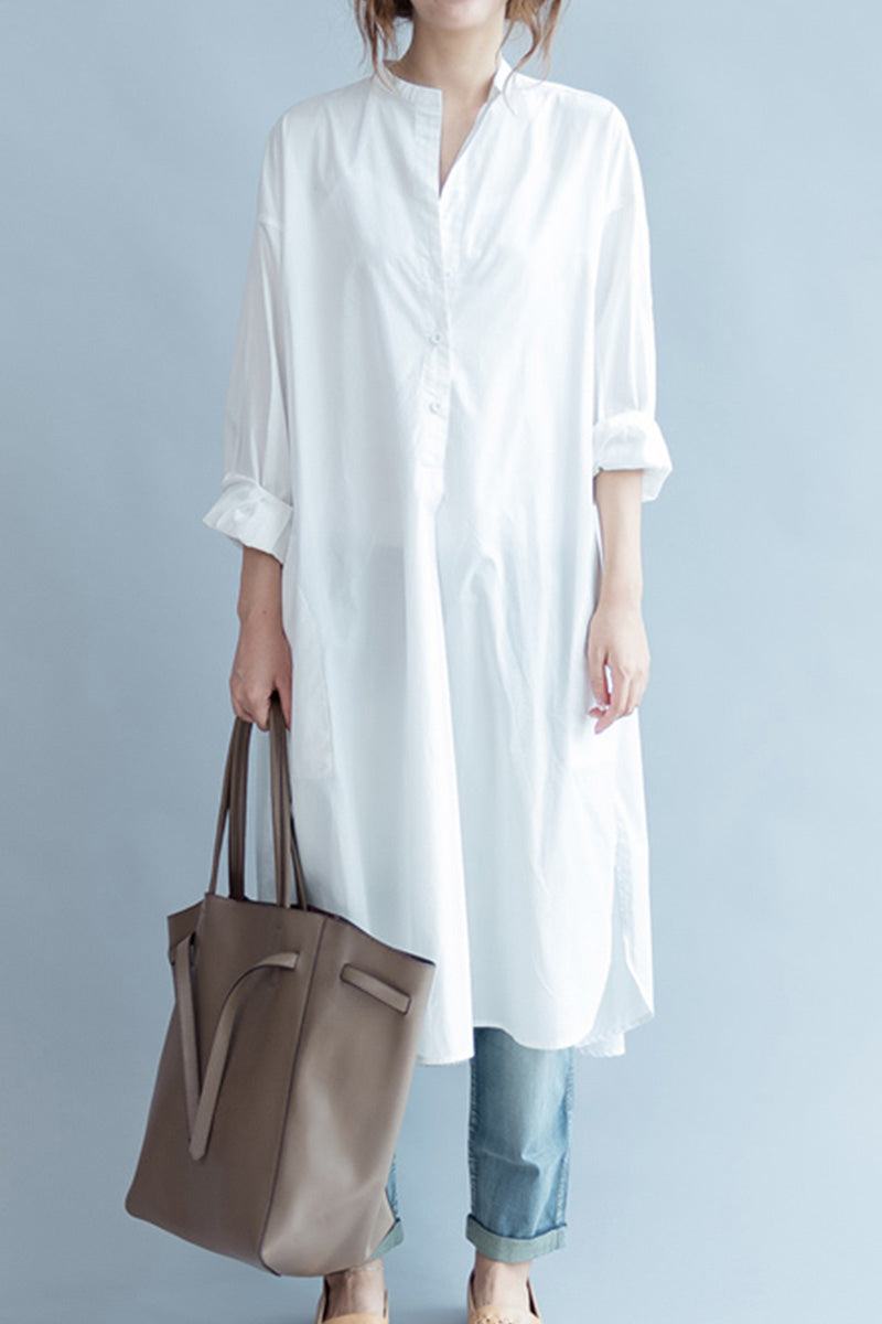 Woman wearing one size pure cotton long shirt with rolled sleeves and carrying brown tote bag