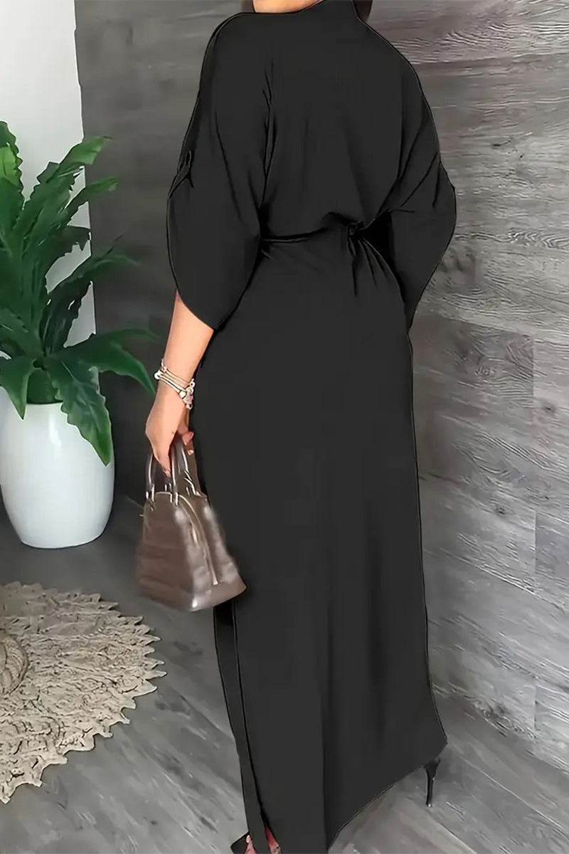 Black All-Day Drape Dress with cinched waist and front slit, breathable wrinkle-resistant polyester fabric.