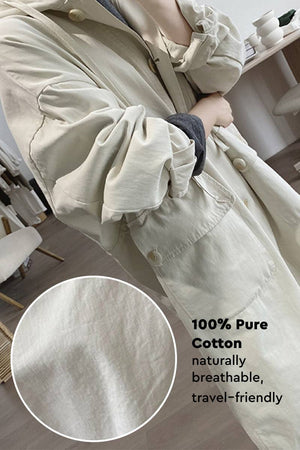 One size travel-ready hooded windbreaker made of 100% pure cotton, breathable and lightweight for comfortable layering.