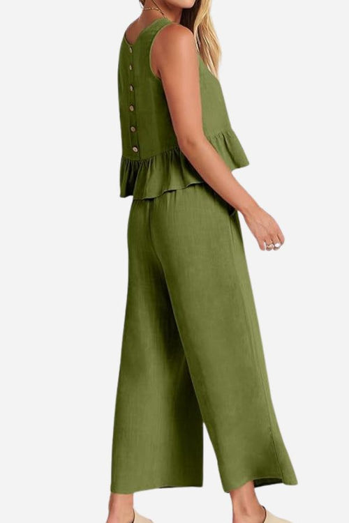 Green linen-like feel set with sleeveless top and wide-leg pants, lightweight and breathable for travel.