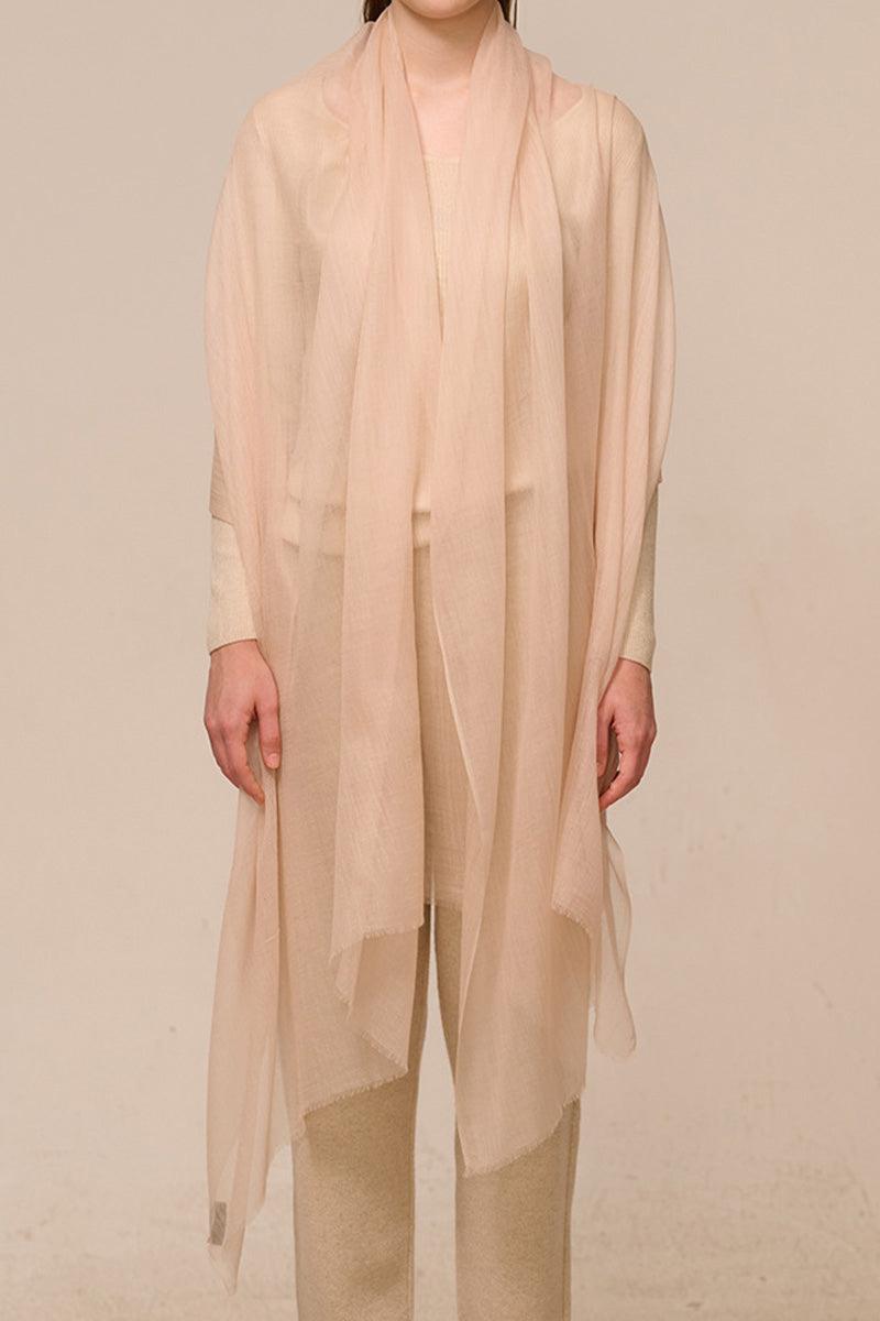 Lightweight 100% cashmere featherlight scarf in soft beige worn by model