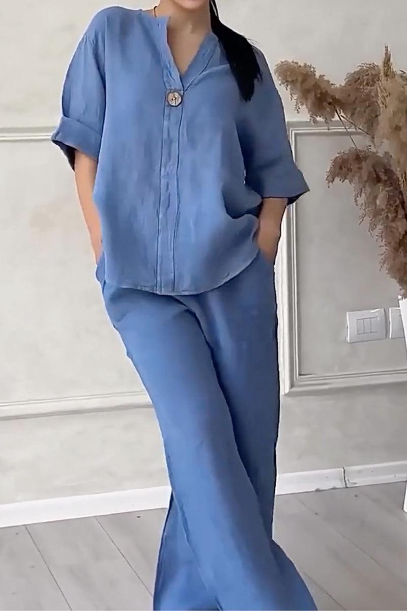 Woman wearing blue pure linen two-piece casual comfort set with loose fit and one-button shirt