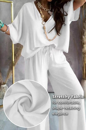 White two-piece pantsuit with V-neck and stretchy polyester fabric for comfortable, elegant fit