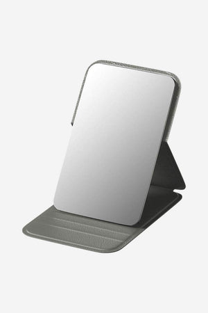 Compact Travel Pocket Mirror with durable PU leather case in grey, lightweight and portable for on-the-go touch-ups.