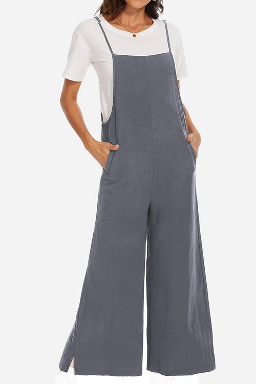 Woman wearing a breathable gray cotton blend comfort jumpsuit with wide legs and pockets over a white t-shirt