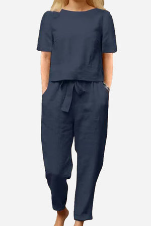 Woman wearing navy cotton-linen blend monochrome two-piece set with relaxed fit and short sleeves