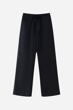 Black wide-leg pants from Mix-Match Lounge-to-Travel Set with a relaxed fit and drawstring waist.