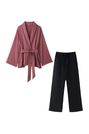 Versatile Mix-Match Lounge-to-Travel Set with dusty rose wrap top and black wide-leg pants, comfortable and stylish polyester outfit for travel and casual wear