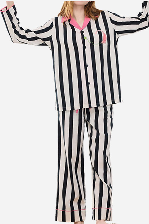 Woman wearing premium moisture-wicking cotton-tencel striped pajama set with pink trim