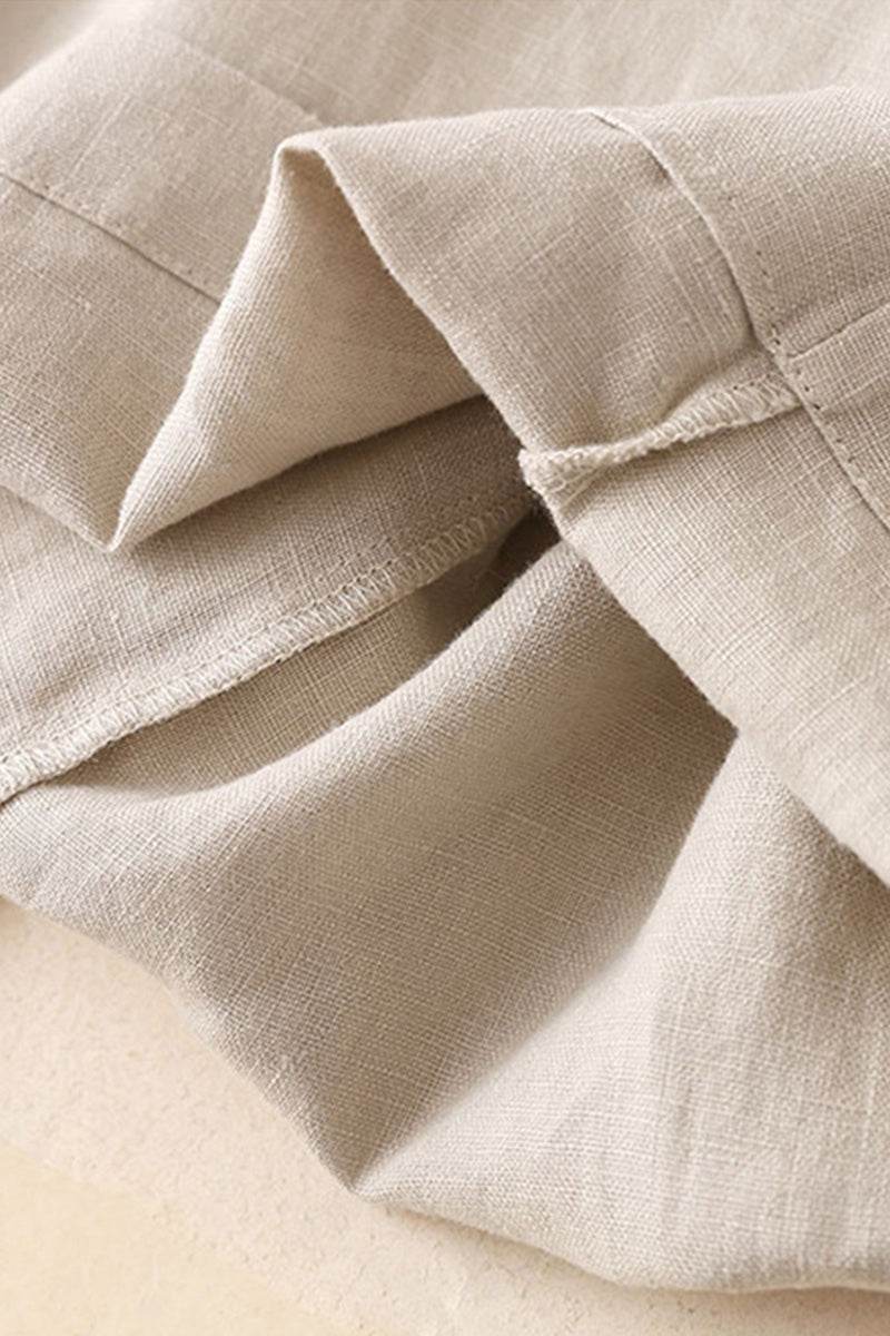 Close-up of beige 100% linen wide-leg pants fabric showing soft natural texture and breathable material
