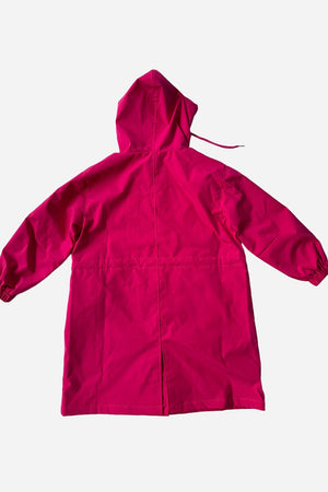 Junior water resistant oversized hooded windbreaker rain jacket in bright pink for kids with waterproof and windproof polyester fabric.