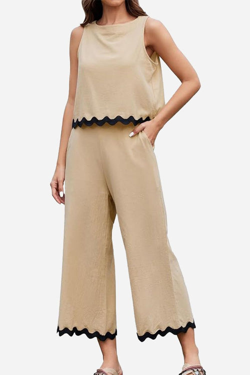 Beige scalloped trim sleeveless top and wide leg pants set with black trim and pockets