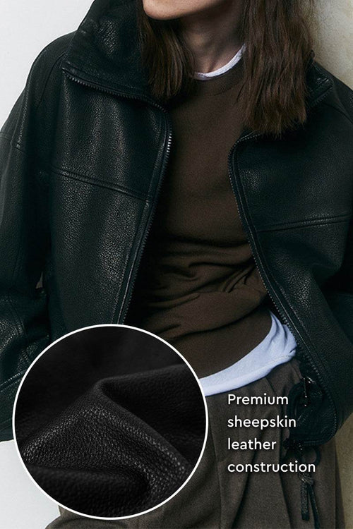 Black sheepskin leather jacket with premium soft leather construction and zipper closure