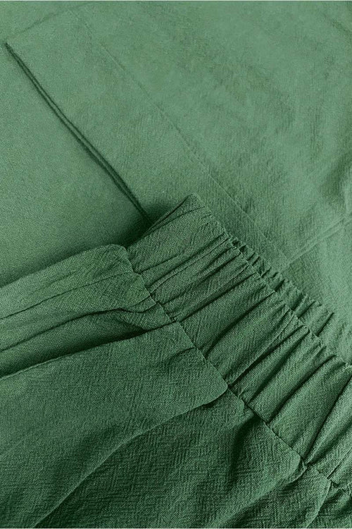 100% cotton green two-piece set with round neck top and wide-leg pants, soft breathable fabric, comfortable fit for travel and casual wear