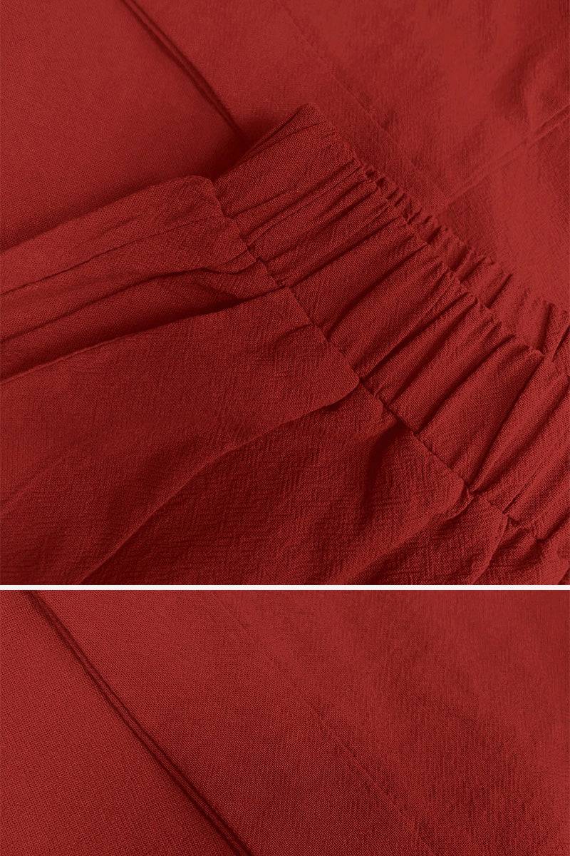 Closup of red 100 cotton two-piece set fabric with elastic waistband and soft breathable texture