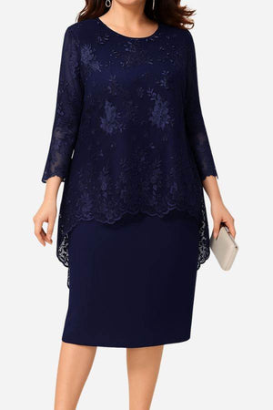 Navy two-piece evening dress with elegant lace details and embroidered top with high-low hem.