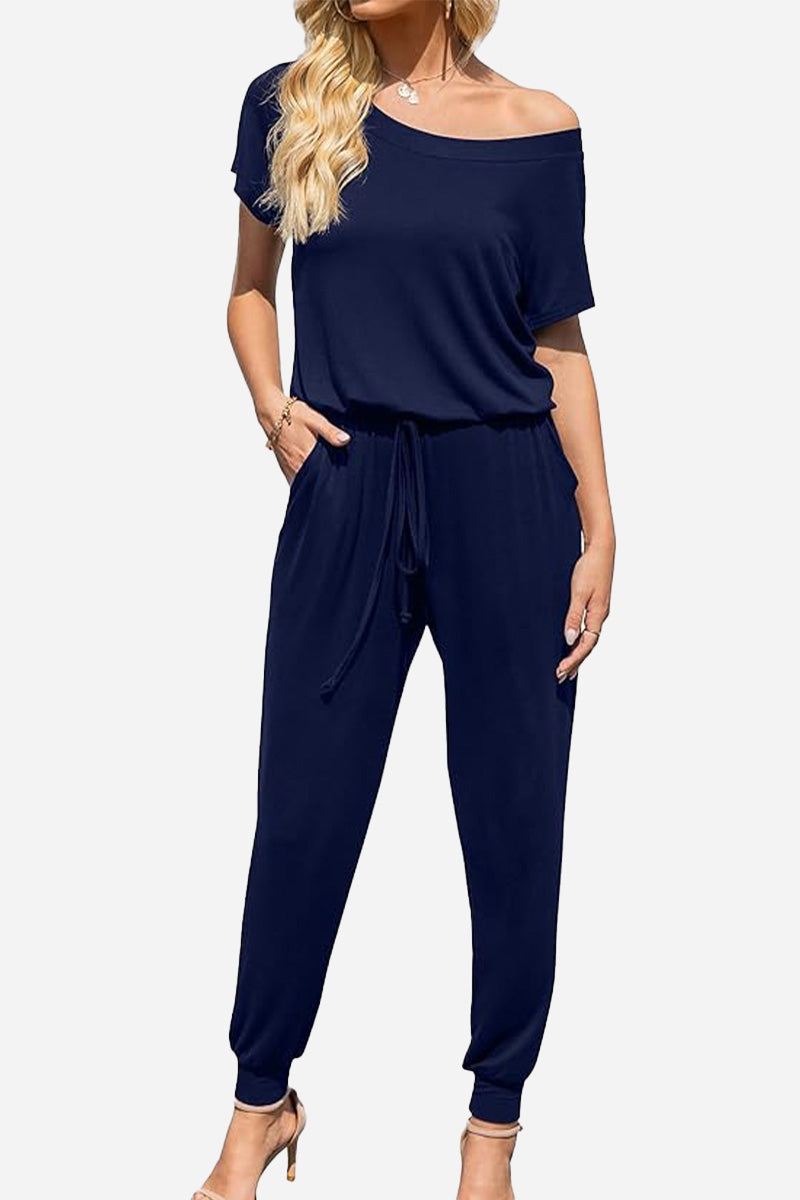 Moonlit Rome Off-Shoulder navy jumpsuit with drawstring waist and tapered legs for elegant casual wear