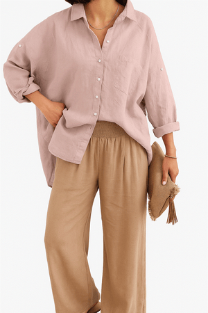 Women wearing Linen Breeze Set with relaxed linen shirt and high-waist cotton blend pants, holding a hat.