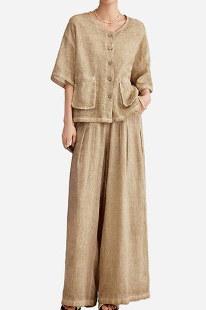 Woman wearing 100% linen stone-washed beige button-up top with double pockets and wide-leg palazzo pants set