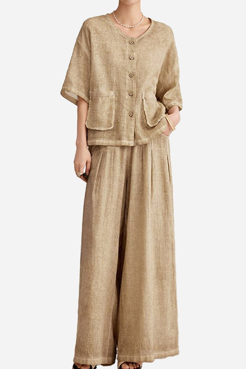 Woman wearing 100% linen stone-washed beige button-up top with double pockets and wide-leg palazzo pants set