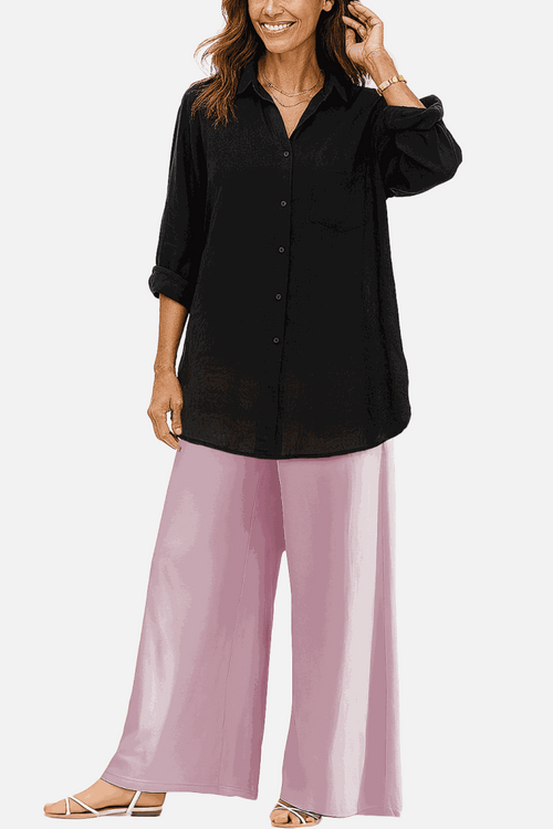 Woman wearing oversized linen leaved-in set with black linen-blend shirt and pink palazzo pants