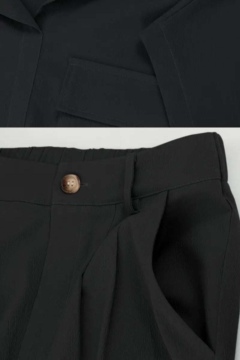 Black two-piece cargo set with big functional pockets and relaxed fit pants